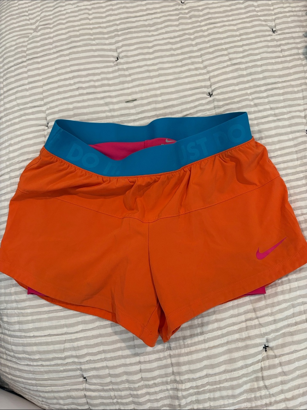 Nike Women’s Orange Athletic Shorts with Teal Waistband and Pink Liner